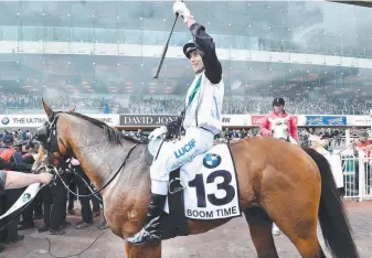  ?? Picture: JAY TOWN ?? Boom Time and jockey Cory Parish celebrate their Caulfield Cup win.