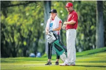  ?? AL CHAREST ?? Calgary’s Steve Blake confers with his caddie, daughter Brooklyn, during Sunday’s final round at the Shaw Charity Classic. Brooklyn was happy that dad had opted for a lighter bag on her day to caddie.