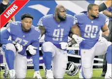  ??  ?? Three members of the Detroit Lions make their point during the anthem before playing the Falcons.