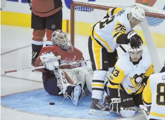  ?? AP PHOTO ?? PAT ON THE HEAD: Conor Sheary (43) gets congratula­tions from Patric Hornqvist after scoring on the Capitals’ Braden Holtby in the Penguins’ 3-2 victory last night.