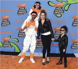  ??  ?? Nick Cannon, center left, Mariah Carey, center right, and from left, their children Moroccan and Monroe arrive at the Kids’ Choice Awards at The Forum in Inglewood, California. — AP/AFP photos