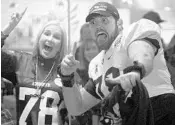  ?? CHRIS HAYS/STAFF ?? UCF tackle Wyatt Miller celebrates with his mother after the Knights’ 2018 Peach Bowl victory over Auburn.