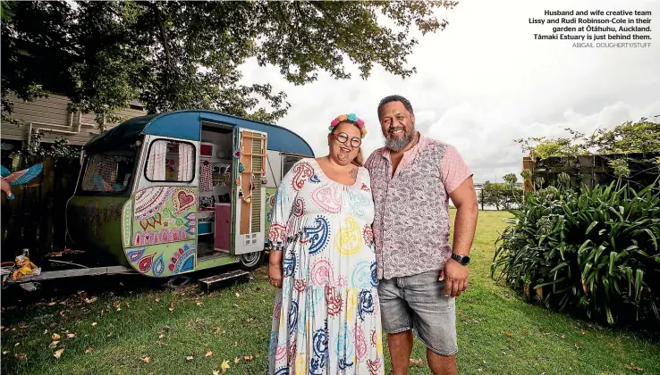  ?? ABIGAIL DOUGHERTY/STUFF ?? Husband and wife creative team Lissy and Rudi Robinson-Cole in their garden at O¯ ta¯huhu, Auckland. Ta¯maki Estuary is just behind them.