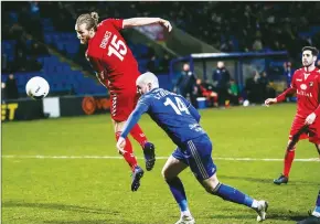  ?? PICTURES: PA ?? CLOSE CALL: Halifax’s Josh Stauton and Ebbsfleet’s Jamie Grimes