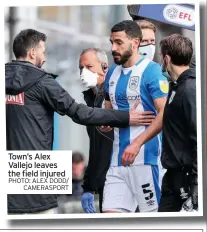  ??  ?? Town’s Alex Vallejo leaves the field injured PHOTO: ALEX DODD/
CAMERASPOR­T
