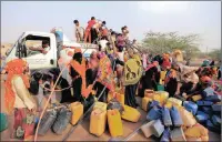  ?? PICTURE: REUTERS ?? People gather around a charity tanker lorry to fill their jerry cans with drinking water in Bajil, Yemen.