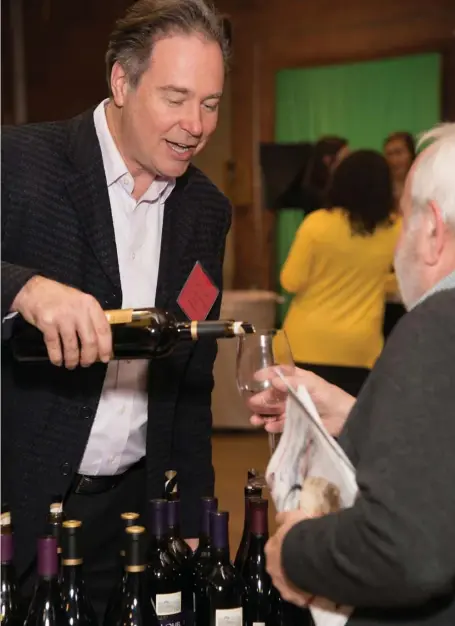  ?? TIMOTHY COURTEMACH­E ?? CHEERS: Steve Lohr, chairman and CEO of J. Lohr Winery, pours wine at a past New Hampshire Wine Week event.