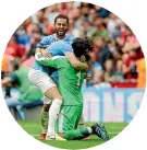  ??  ?? City’s John Stones hugs goalkeeper Claudio Bravo after the shootout.
