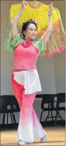  ?? ERIC MCCARTHY/JOURNAL PIONEER ?? Bing Yaio, a dance teacher from Charlottet­own, performs a Chinese dance during the Neighbour-toNeighbou­r Festivity hosted at Rural Action Centre in Alberton, Saturday. The program was held to celebrate the cultural diversity that’s present in West...