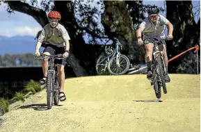  ?? DAVID UNWIN/STUFF ?? Harry Wells, left, and Finn O’brien take the maiden ride on the new bike track at O¯ piki School.