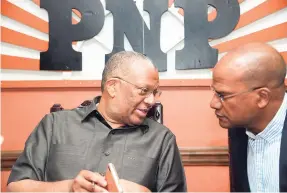  ??  ?? Peter Bunting (right), seen here with PNP President and Opposition Leader Peter Phillips, has surrendere­d, for now, his right to challenge for the leadership of the party, perhaps waiting for the perfect time.