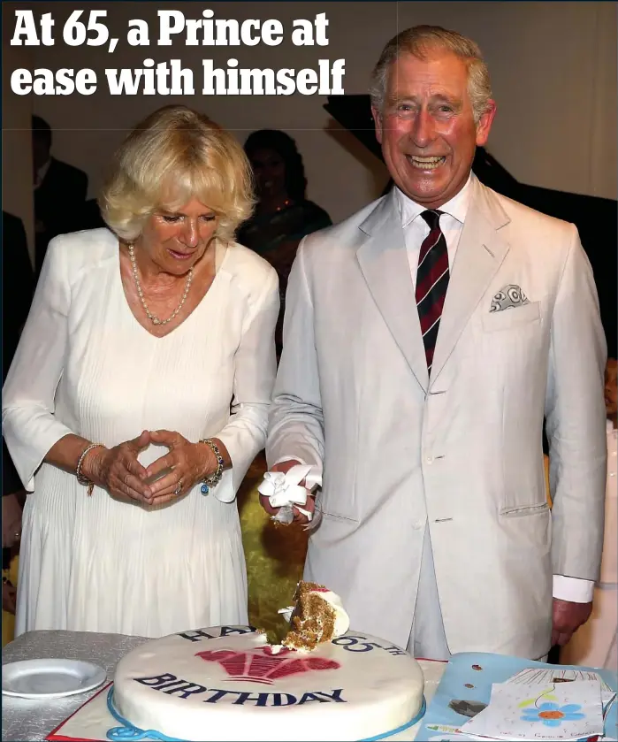  ??  ?? Slice of happiness: Camilla looks on warily as a beaming Prince Charles cuts into his 65th birthday cake in Sri Lanka yesterday — with slightly messy results