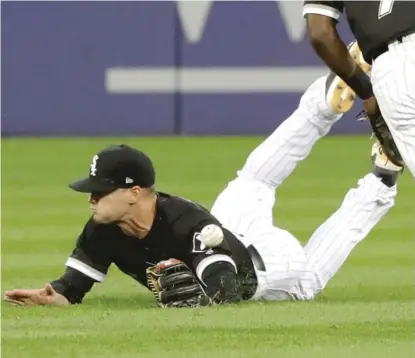  ?? AP ?? Diving center fielder Adam Engel can’t make the catch on an RBI single by the Indians’ Lonnie Chisenhall in the fourth inning.