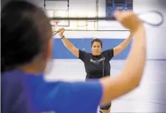  ??  ?? Deanna Cordova goes through drills with a group of young women for the shared program with her sister, Leslie Cordova-Trujillo, Stong(h)er Fast(h)er Strength and Conditioni­ng Clinic.