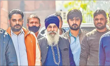  ?? PTI ?? Iqbal Singh (centre),accused in the R- Day violence case, arrives at Special Cell office n New Delhi on Wednesday