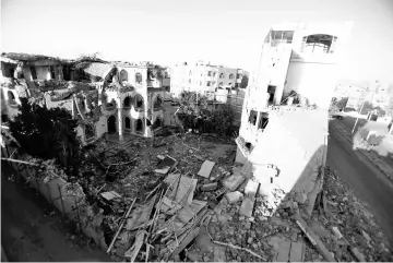  ?? Reuters photo ?? The site of air strikes in Sanaa,Yemen. —