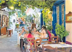  ??  ?? iA taverna at Manolates, on Samos, an island so close to Turkey ‘you can almost touch it’