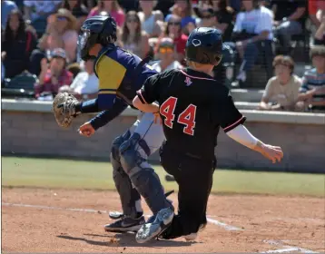  ?? PHOTOS BY ROBERT CASILLAS ?? Palos Verdes' Kendall Ward slides home to score in a CIF-SS Division 2quarterfi­nal playoff game against Millikan.