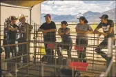  ?? ?? Fair attendees relax beside the livestock pens at the Taos County Fair on Sunday (Aug. 22).
