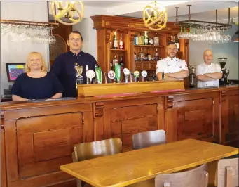  ??  ?? Chefs Marek Slowik and Tadas Vainauskas and owners Sean and Elaine Byrne at the Strand Tavern.