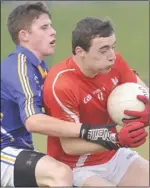  ??  ?? Louth’s Conor Hennessy is tackled by John Kavanagh.