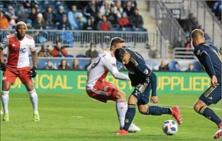  ?? MICHAEL REEVES — FOR DIGITAL FIRST MEDIA ?? The Union’s Anthony Fontana fights the opening goal in his MLS debut. for the ball in the box during a 2-0 win over New England Saturday. Fontana scored