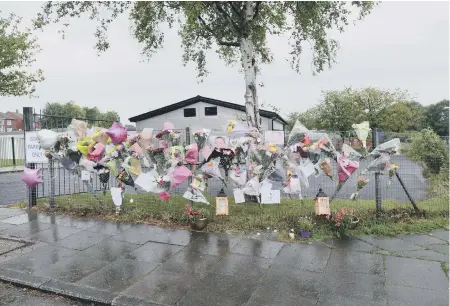  ??  ?? Floral tributes at West Boldon Primary School, which shut today as a mark of respect to stabbing victim Julie Parkin.