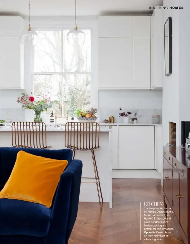  ??  ?? KITCHEN
The bespoke kitchen is by Phillips Design Studio. Midas bar stools from Rockett St George and glass pendants from Mullan Lighting are perfect for this airy space
Opposite Carrie chose art from Nelly Duff as a finishing touch