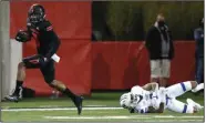  ??  ?? Arkansas State University wide receiver Jonathan Adams Jr. (left) slips away from Georgia State safety Chris Bacon during the fourth quarter of the Red Wolves’ victory over the Panthers on Thursday at Centennial Bank Stadium in Jonesboro. Adams and teammate Dahu Green combined for 24 catches, 349 yards and 4 touchdowns in the victory.
(Arkansas Democrat-Gazette/Thomas Metthe)