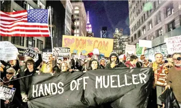  ??  ?? People take part in a protest to protect the investigat­ion led by Special Counsel Robert Mueller, in New York City, US. — Reuter photo