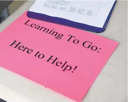  ?? PAULW. GILLESPIE ?? Anne Arundel County Public Schools handed out learning packets, along with the daily meals to kids, at Freetown Elementary School.