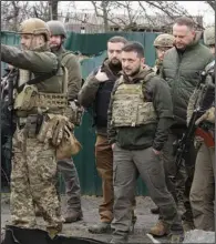  ?? (AP file/Efrem Lukatsky) ?? Ukrainian President Volodymyr Zelenskyy examines the site of a recent battle in Bucha close to Kyiv, Ukraine on April 4.