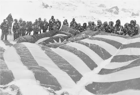  ??  ?? Participan­ts of Annapurna expedition in a group photo after arriving at the Annapurna Base Camp (ABC). — Bernama photo