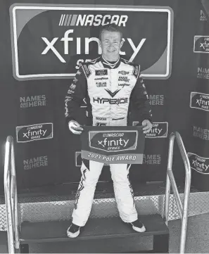  ?? JENNA WATSON/INDIANAPOL­IS STAR ?? NASCAR Xfinity Series driver AJ Allmending­er poses for photos after winning the pole position for the Pennzoil 150 on Aug. 14.