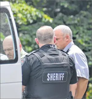  ?? RYAN ROSS/THE GUARDIAN ?? Paul Wilfred Manning, left, seen through the window of a Provincial Correction­al Centre van, leaves provincial court in Georgetown after a judge sentenced him to almost two years in jail.