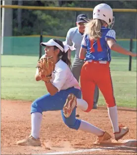  ??  ?? Ringgold first baseman Alex Huerta fields a throw across the diamond to nip a Northwest runner by a step. However, the Lady Bruins were able to slip past the Lady Tigers, 4-3, during the Dalton Lady Cat Classic on Saturday.