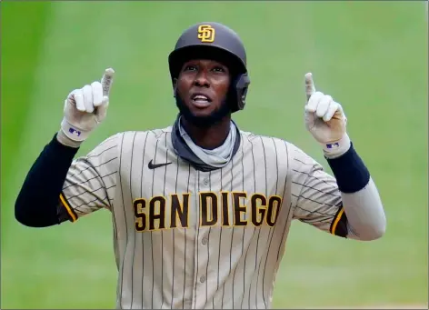  ?? AP Photo/David Zalubowski ?? San Diego Padres’ Jurickson Profar gestures as he circles the bases after hitting a solo home run off Colorado Rockies relief pitcher James Pazos in the eighth inning of a baseball game in Denver, in this Aug. 30, 2020, file photo.