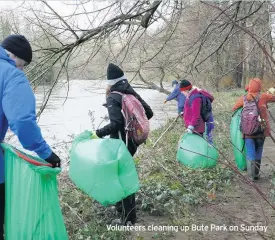  ??  ?? Volunteers cleaning up Bute Park on Sunday