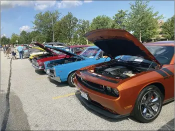  ?? ANDREW CASS — THE NEWS-HERALD ?? Classic cars of all makes and models filled the parking lot of the Mentor Civic Center Aug. 14for the annual Mentor Cruise-In.