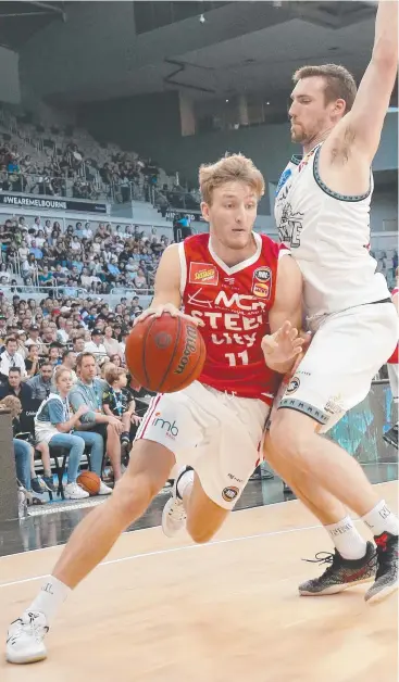  ??  ?? YOUNG GUN: Illawarra Hawks’ Daniel Grida drives to the basket during the round 15 defeat by Melbourne United on Wednesday, Grida has Cairns in his sights today. Picture: GETTY/DARRIAN TRAYNOR