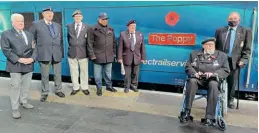  ?? Direct Rail Services ?? Armed forces veterans from Carlisle and London gather in front of the newly named 68033 The Poppy at London Euston station on October 30.