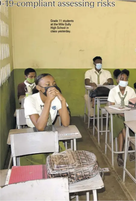  ??  ?? Grade 11 students at the Mile Gully High School in class yesterday.