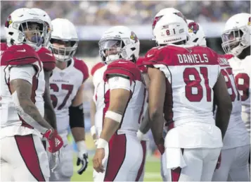  ?? (Photos: AP) ?? Arizona Cardinals players huddle during an NFL football game against the Los Angeles Rams Sunday, October. 3, 2021 in Inglewood, California.