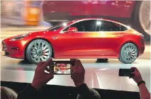  ?? JUSTIN PRITCHARD/THE ASSOCIATED PRESS/FILES ?? Motor Trend called Tesla’s Model 3 “the most important vehicle of the century,” although potential customers are complainin­g about battery upgrade costs.