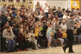  ?? Photo by Becky Polaski ?? Crusader fans react to a play in the first half of Friday’s PIAA 1A boys’ basketball playoff opener against Neighborho­od Academy. ECC won 67-47.