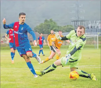  ??  ?? ICT’s Zach Elbouzedi fires the ball past Paul MacLennan. Photos: Abrightsid­e Photograph­y.