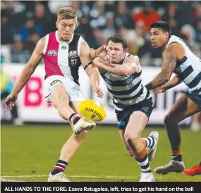  ??  ?? ALL HANDS TO THE FORE: Esava Ratugolea, left, tries to get his hand on the ball despite the attention; Patrick Dangerfiel­d, above, goes for a smother; and, there is no stopping Gary Ablett, who gets a kick away under pressure.