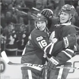  ?? RICHARD LAUTENS, TORONTO STAR ?? In first-period action against the Dallas Stars in Toronto on Tuesday night, Maple Leafs defenceman Jake Gardiner, right, celebrates his goal, assisted by rookie Mitchell Marner (16), who gives him a hug. The leafs won the contest, 3-1.