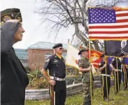  ?? Charles Krupa / Associated Press ?? Members of the Veterans of Foreign Wars honor the flag at a Veterans Day ceremony in Derry, N. H.