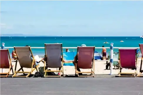  ?? (Tommy Lee Walker) ?? Deck chairs on Weymouth’s l ong promenade